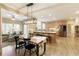 Open kitchen and breakfast area with stainless steel appliances and hardwood flooring at 325 N Saint Phillip Ln, Alpharetta, GA 30022