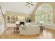Bright living room with large windows, fireplace, and built-in shelving for storage at 325 N Saint Phillip Ln, Alpharetta, GA 30022