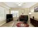 Home office featuring wood floors, natural light, and a dedicated workspace at 325 N Saint Phillip Ln, Alpharetta, GA 30022