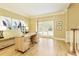 Spacious home office with hardwood floors, abundant natural light, and ample desk space at 325 N Saint Phillip Ln, Alpharetta, GA 30022