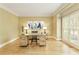 Bright home office with hardwood floors, natural light, and a modern desk setup at 325 N Saint Phillip Ln, Alpharetta, GA 30022