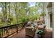 Wood deck with outdoor seating and privacy, perfect for enjoying the scenery at 325 N Saint Phillip Ln, Alpharetta, GA 30022