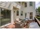 Deck featuring outdoor seating area, ideal for enjoying the outdoor view of lush green landscaping at 325 N Saint Phillip Ln, Alpharetta, GA 30022