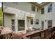 Exterior view of patio with outdoor seating, perfect for relaxing and entertaining at 325 N Saint Phillip Ln, Alpharetta, GA 30022