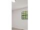Neutral bedroom featuring a carpeted floor, and a black grid window at 7244 Valley Dr, Winston, GA 30187