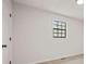 Neutral bedroom featuring a standard door, black hardware, and a black grid window at 7244 Valley Dr, Winston, GA 30187