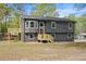 Charming home featuring a gray exterior, complemented by a spacious deck, perfect for outdoor entertaining at 7244 Valley Dr, Winston, GA 30187