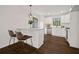 Bright and stylish kitchen with white cabinets, stainless steel appliances, and a convenient breakfast bar at 7244 Valley Dr, Winston, GA 30187