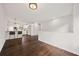 Open concept living and kitchen area with dark hardwood floors and fresh white paint at 7244 Valley Dr, Winston, GA 30187