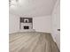 Living room with wood-look floors and a stone fireplace feature at 7244 Valley Dr, Winston, GA 30187