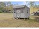 Backyard shed with double doors and windows on a spacious lawn at 7244 Valley Dr, Winston, GA 30187