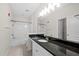 Bathroom featuring granite countertops, white cabinets, and tile flooring at 10 Perimeter Summit Ne Blvd # 2110, Brookhaven, GA 30319