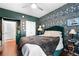 A beautifully decorated bedroom featuring unique wallpaper, a plush bed, and stylish furnishings, creating a cozy retreat at 10 Perimeter Summit Ne Blvd # 2110, Brookhaven, GA 30319
