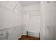Walk-in closet with shelving and shoe rack at 10 Perimeter Summit Ne Blvd # 2110, Brookhaven, GA 30319