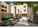 Quiet courtyard with decorative columns, greenery, and a paved walkway at 10 Perimeter Summit Ne Blvd # 2110, Brookhaven, GA 30319