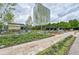 Community courtyard featuring stone walkways, lush landscaping, and an outdoor lounge area at 10 Perimeter Summit Ne Blvd # 2110, Brookhaven, GA 30319