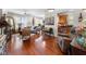 Open-concept living room with hardwood floors, comfortable seating, and modern decor at 10 Perimeter Summit Ne Blvd # 2110, Brookhaven, GA 30319