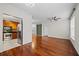 Open concept living room with hardwood floors and stainless steel appliances in kitchen area at 10 Perimeter Summit Ne Blvd # 2110, Brookhaven, GA 30319