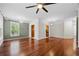 Spacious living room with hardwood floors, chandelier, and ceiling fan at 10 Perimeter Summit Ne Blvd # 2110, Brookhaven, GA 30319