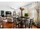 Open floor plan featuring dining area adjacent to a comfortable living space with hardwood floors at 10 Perimeter Summit Ne Blvd # 2110, Brookhaven, GA 30319
