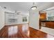 Open concept living room with hardwood floors and stainless steel appliances in kitchen area at 10 Perimeter Summit Ne Blvd # 2110, Brookhaven, GA 30319