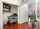 Cozy office nook featuring floating shelves and hardwood floors at 10 Perimeter Summit Ne Blvd # 2110, Brookhaven, GA 30319