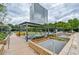 Beautiful outdoor lounge area with seating, water features, and lush landscaping at 10 Perimeter Summit Ne Blvd # 2110, Brookhaven, GA 30319