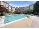 Large community pool with lounge chairs and well-maintained landscaping and apartment building backdrop at 10 Perimeter Summit Ne Blvd # 2110, Brookhaven, GA 30319