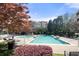 Large community pool with lounge chairs and well-maintained landscaping on a sunny day at 10 Perimeter Summit Ne Blvd # 2110, Brookhaven, GA 30319