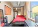 Modern bedroom featuring exposed ductwork, large window, and unique art, creating an industrial chic aesthetic at 115 W Peachtree Nw Pl # 304, Atlanta, GA 30313