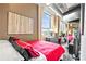 Bright bedroom with exposed ductwork and large window providing natural light, complemented by chic decor and an open layout at 115 W Peachtree Nw Pl # 304, Atlanta, GA 30313