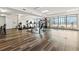 Bright community gym featuring modern exercise equipment and large windows offering city views, perfect for an active lifestyle at 115 W Peachtree Nw Pl # 304, Atlanta, GA 30313