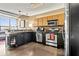 Bright kitchen with stainless appliances, concrete floors, and island; open layout at 115 W Peachtree Nw Pl # 304, Atlanta, GA 30313