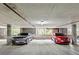 Well-lit parking garage with assigned parking and security features at 115 W Peachtree Nw Pl # 304, Atlanta, GA 30313
