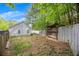 Backyard featuring a wooden exterior structure for additional storage and a grassy area at 1164 Britley Park Ln, Woodstock, GA 30189