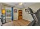 Bedroom with exercise equipment, neutral walls, and natural light at 1164 Britley Park Ln, Woodstock, GA 30189
