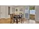 Hardwood floors with view of the dining room table with seating for four at 1164 Britley Park Ln, Woodstock, GA 30189