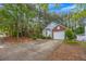 Charming home with a one car garage, long driveway and manicured landscape in the front at 1164 Britley Park Ln, Woodstock, GA 30189