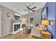 Living room features hardwood floors, a fireplace and a mounted tv at 1164 Britley Park Ln, Woodstock, GA 30189
