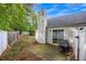 Outdoor patio with privacy fence, sliding glass doors, and a grill, perfect for entertaining at 1164 Britley Park Ln, Woodstock, GA 30189