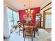 Charming dining room with a round table, chandelier, and natural light at 1552 Longwood Dr, Lawrenceville, GA 30043