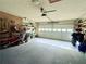 Spacious two car garage with standard lift garage door, shelving, peg board, and plenty of room at 1552 Longwood Dr, Lawrenceville, GA 30043