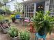Outdoor patio features table and chairs surrounded by lush plants and greenery at 1552 Longwood Dr, Lawrenceville, GA 30043