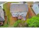 Aerial shot of home, deck, patio, and backyard, surrounded by trees at 2045 Villa Spring Ct, Dacula, GA 30019