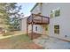 Exterior view of backyard with deck above the walkout basement door at 2045 Villa Spring Ct, Dacula, GA 30019