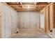Unfinished basement with concrete walls, utility lines, and exposed ceiling at 2045 Villa Spring Ct, Dacula, GA 30019