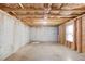 An unfinished basement features poured concrete walls and exposed framing at 2045 Villa Spring Ct, Dacula, GA 30019