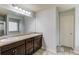 Primary bathroom boasts double sinks, a large mirror, and tiled floors at 2045 Villa Spring Ct, Dacula, GA 30019