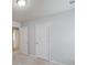 Well-lit bedroom with neutral carpet, two doors and neutral walls at 2045 Villa Spring Ct, Dacula, GA 30019