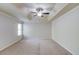 Spacious primary bedroom featuring neutral carpet and ceiling fan at 2045 Villa Spring Ct, Dacula, GA 30019